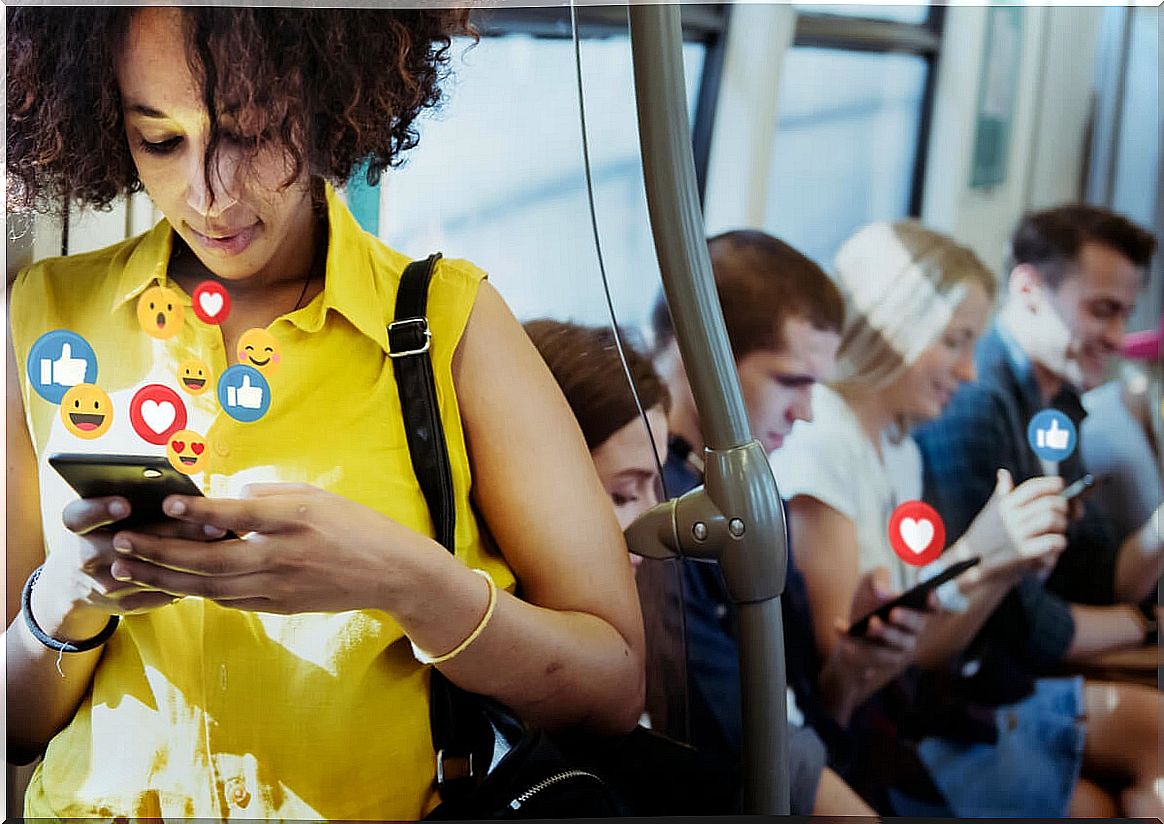 People looking at mobiles on the bus