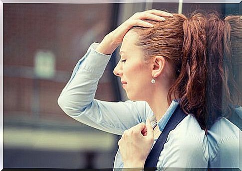 Woman stressed by excessive work