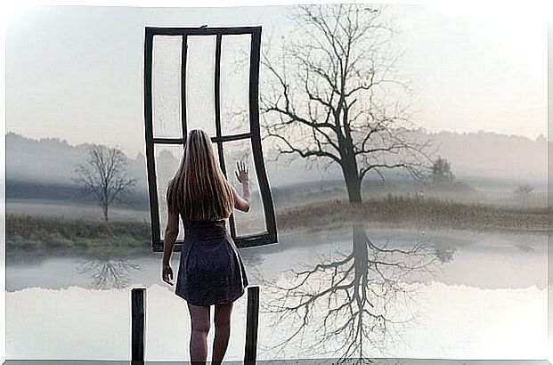 woman in front of a window suspended in the air representing assertive communication