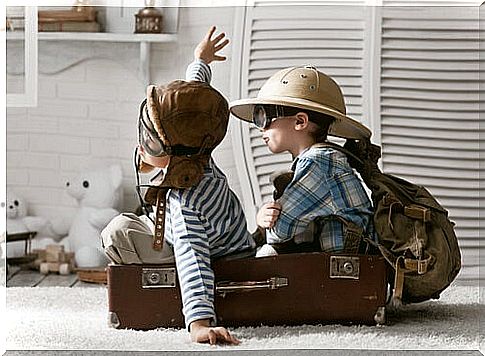 Children playing riding on a toy plane