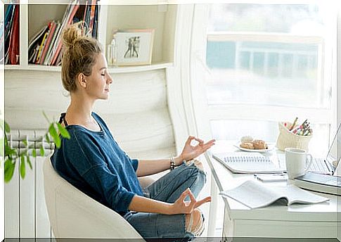 Woman with eyes closed meditating