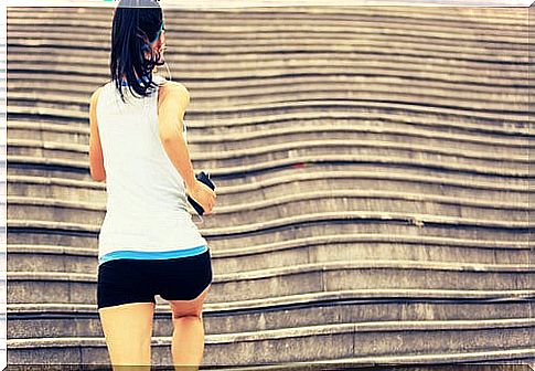 Woman climbing stairs doing sports