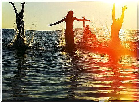 People in the sea enjoying