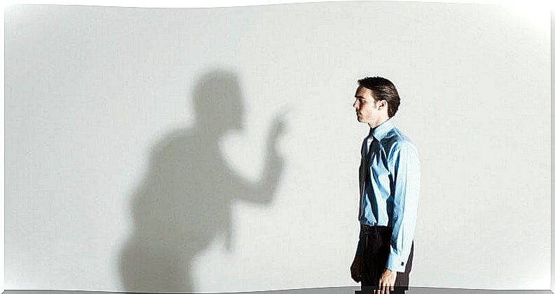 shadow threatening a man symbolizing the child who continues to suffer