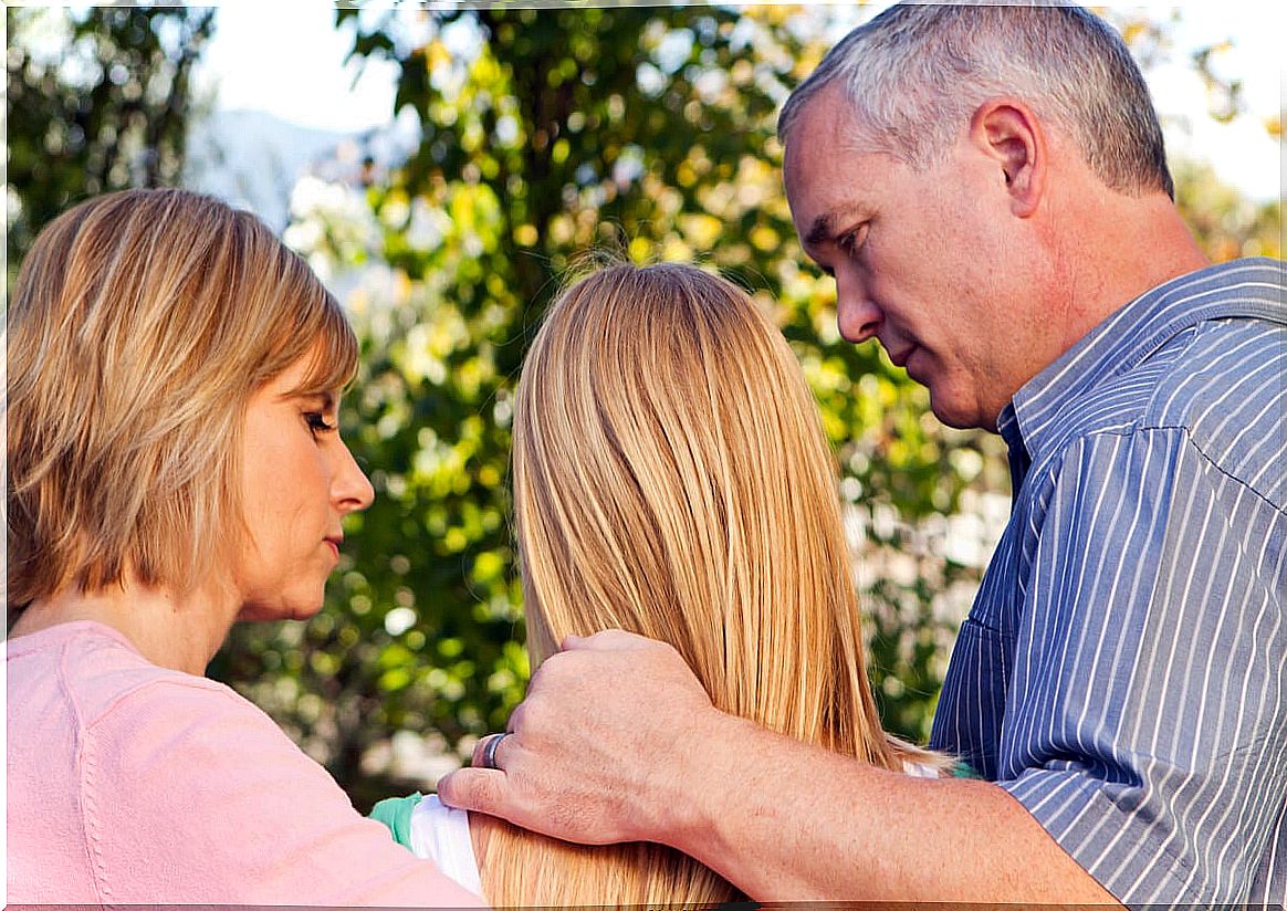 Parents talking to their teenage daughter