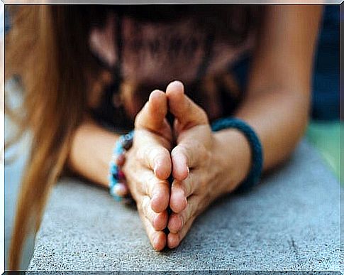 Hands clasped in namaste expression