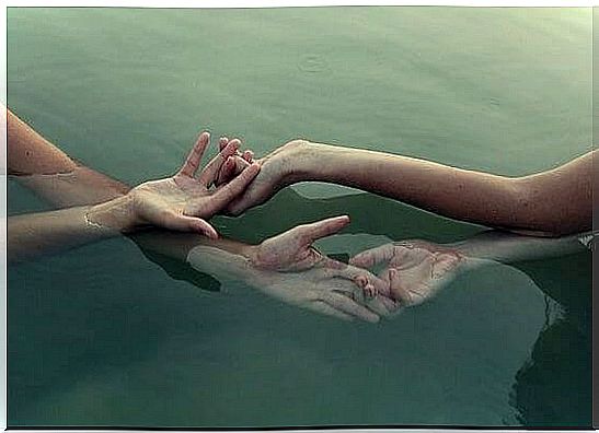 Caress of several hands in the water