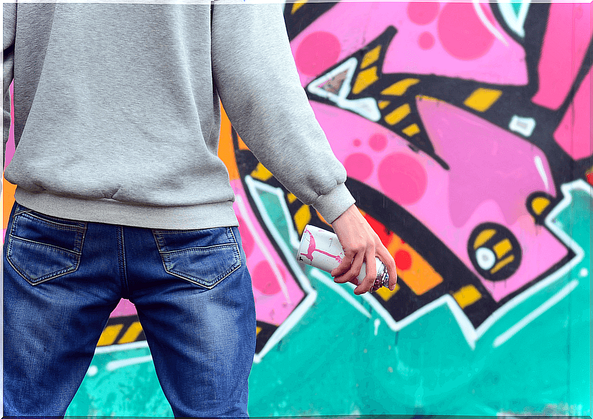 Boy doing a graffiti