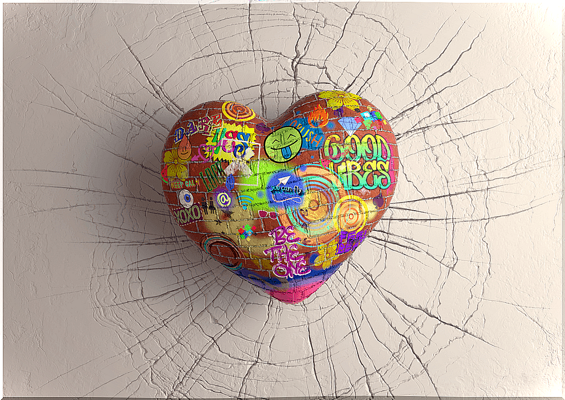 Stone heart with graffiti on a wall