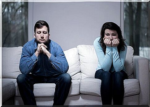 Couple on sofa symbolizing when it happens to our brain when we get angry