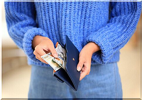 Woman with money in wallet