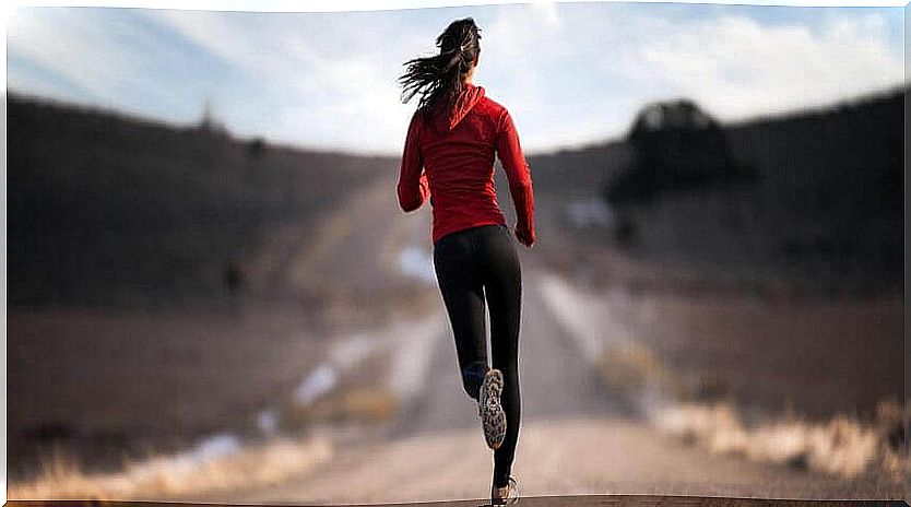 Woman running down the road