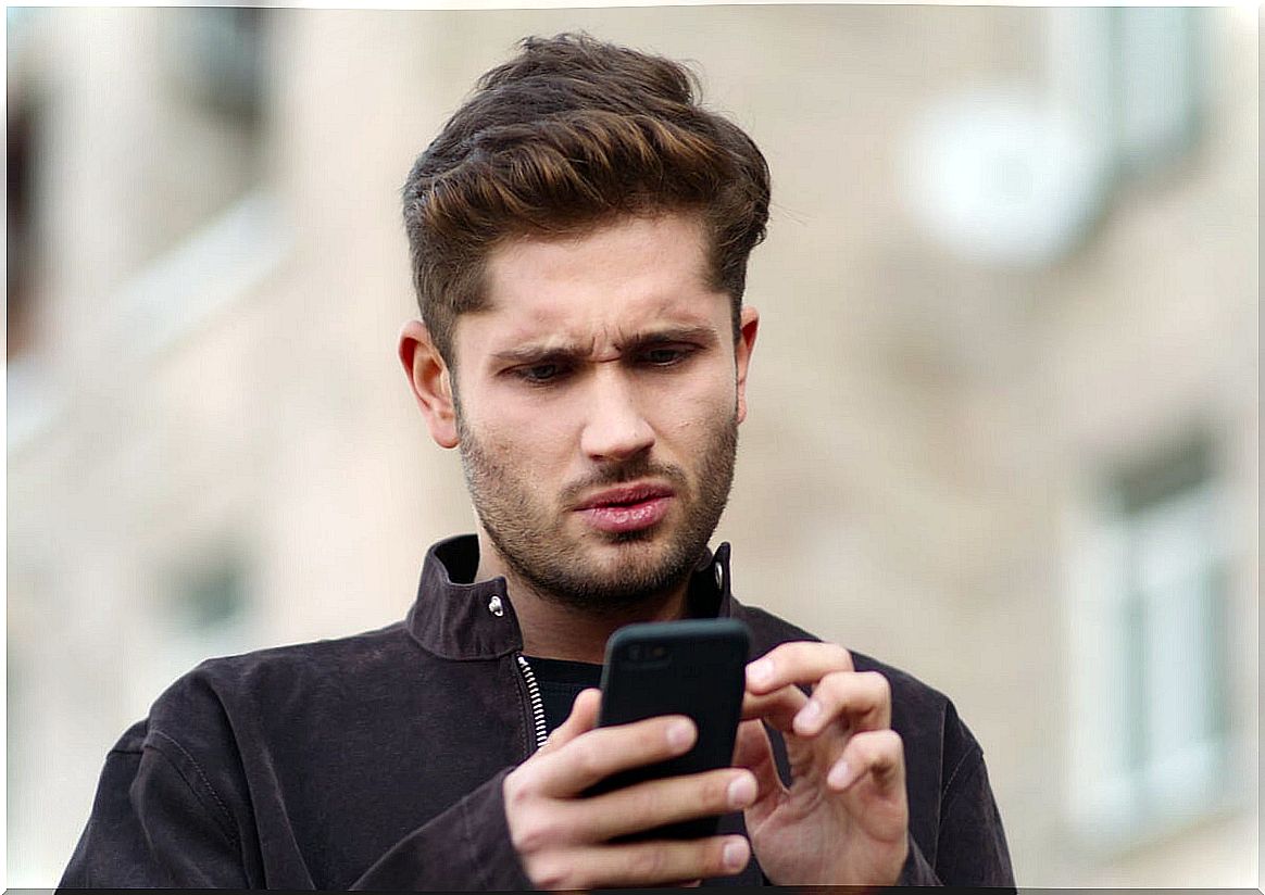 Man reading mobile messages